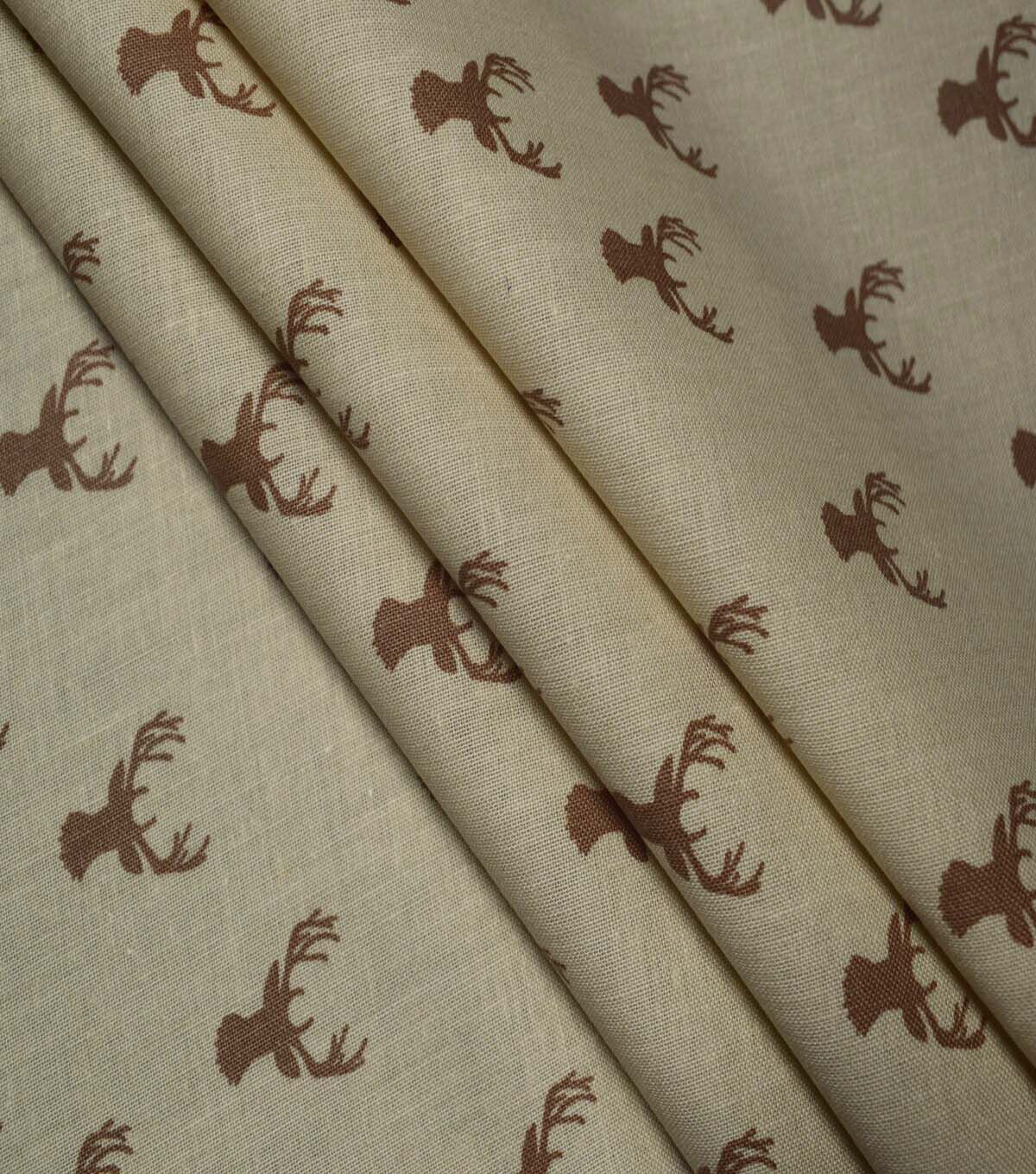 In the Wild Stag Heads on Brown Cotton Fabric by Quilter's Showcase