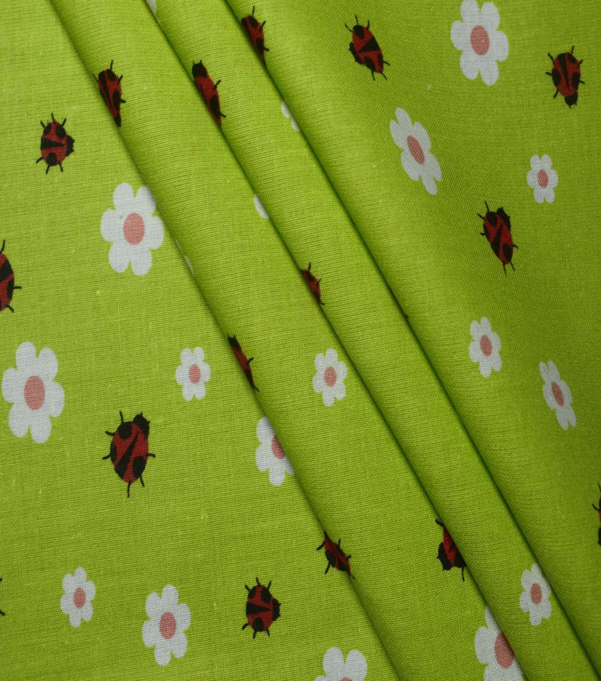 Ladybugs & Daisies on Green Cotton Fabric by Quilter's Showcase