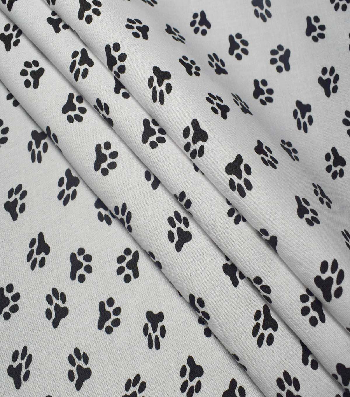 Paw Print on White Cotton Fabric by Quilter's Showcase